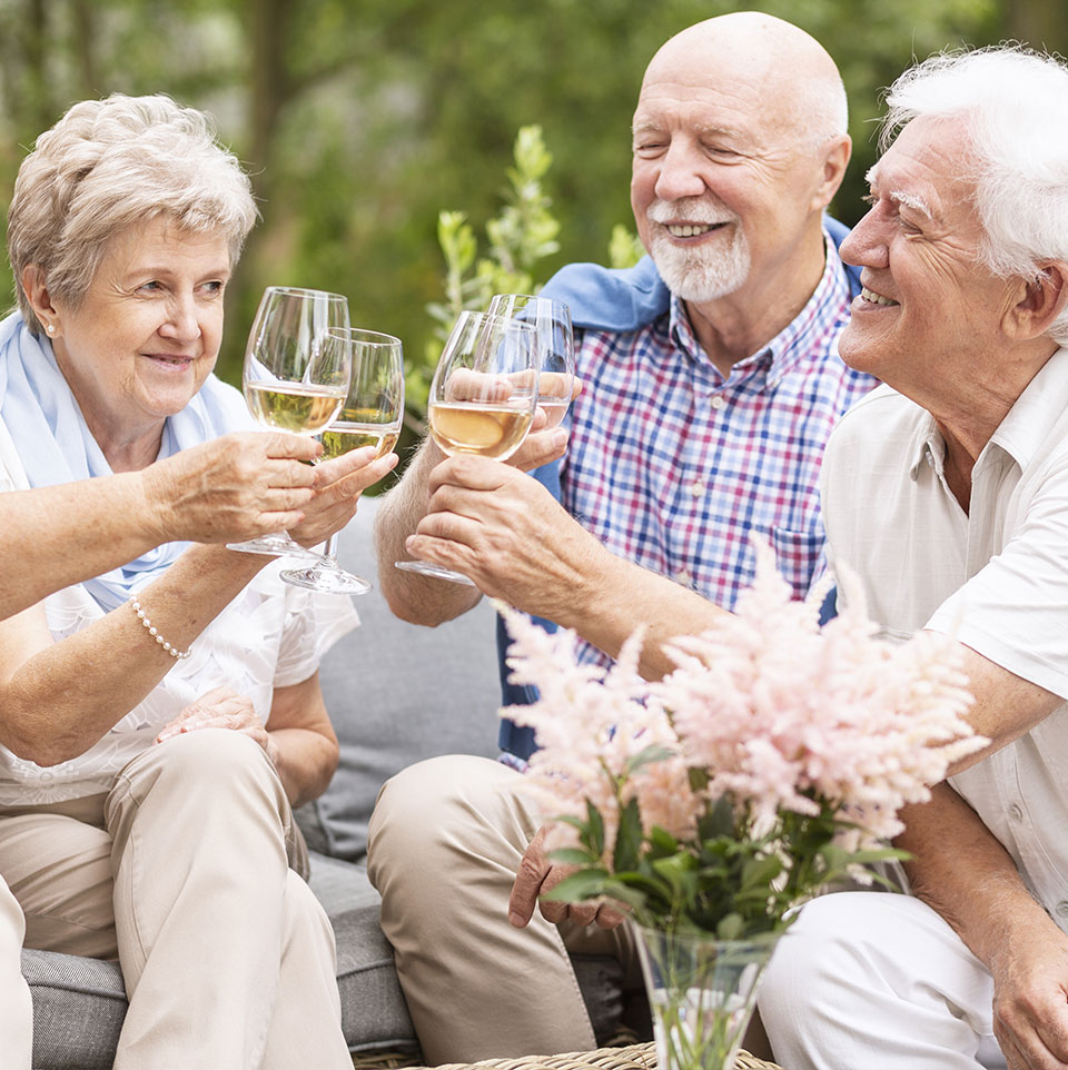 elderly people enjoying a drink